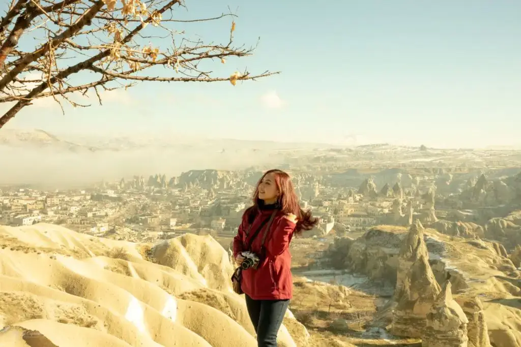 Woman standing on a hill in Cappadocia in Turkey