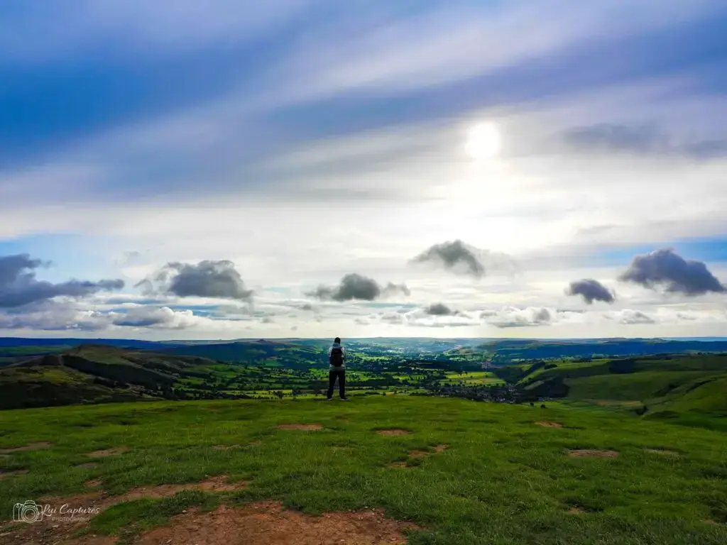 Lui Captures photographing a landscape of a man standing on a hill in the Peak District of England